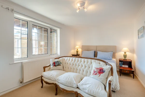 Beach House holiday let in Greatstone, Kent. Double bedroom with sofa.