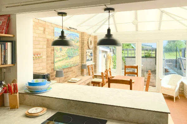 Beach House holiday let in Greatstone, Kent. Dining Conservatory from Kitchen.